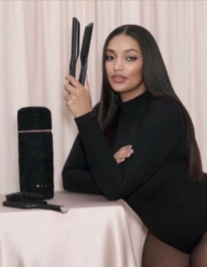A model holding a GHD styler, from the new GHD Sculpt gift set